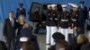 President Barack Obama and Secretary of State Hillary Rodham Clinton walk back to their seats after speaking during the Transfer of Remains Ceremony at Andrews Air Force Base in Maryland, September 14, 2012.