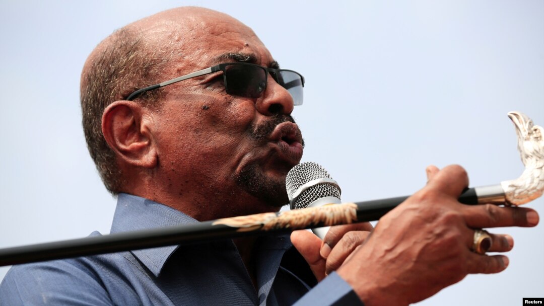 FILE - Sudan's President Omar al-Bashir addresses supporters during his visit to the war-torn Darfur region, in Bilal, Darfur, Sudan Sept. 22, 2017. 