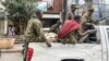 Members of the Amhara militia that sides with federal and regional forces against the northern region of Tigray ride on the back of a pick up truck in the city of Gondar, Ethiopia, Nov. 8, 2020.