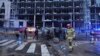 First responders work the scene following a Russian missile attack in Kyiv, Ukraine, on Jan. 18, 2025.