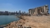 Rubble and debris remain around towering grain silos gutted in the site of a massive deadly explosion in August last year, at the port in Beirut, Lebanon, July 13, 2021. 