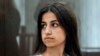 FILE - Angelina Khachaturyan attends a court hearing in Moscow, Russia, June 26, 2019. She and her two sisters are accused of murdering their father who, investigators confirmed, abused them for years.