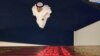 An Emirati trader checks the stocks on the screen at the Dubai Financial Market in Dubai, United Arab Emirates, Sunday, March 8, 2020.