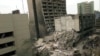 FILE - The United States Embassy, left, is pictured with blasted ruins next to it in downtown Nairobi, Kenya, Aug. 8, 1998, the day after terrorist bombings in Kenya and Dar es Salaam, Tanzania.