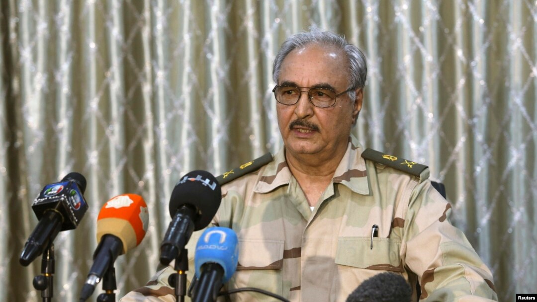 FILE - General Khalifa Haftar speaks during a news conference at a sports club in Abyar, a small town to the east of Benghazi.