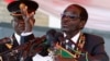 Zimbabwe's President Robert Mugabe addresses the crowd gathered to commemorate Heroes Day, in Harare, Zimbabwe, Aug. 12, 2013.
