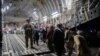 Afghans board a U.S. Air Force C-17 Globemaster III transport plane during an evacuation at Hamid Karzai International Airport, Afghanistan, August 22, 2021. (U.S. Air Force/Handout via Reuters)