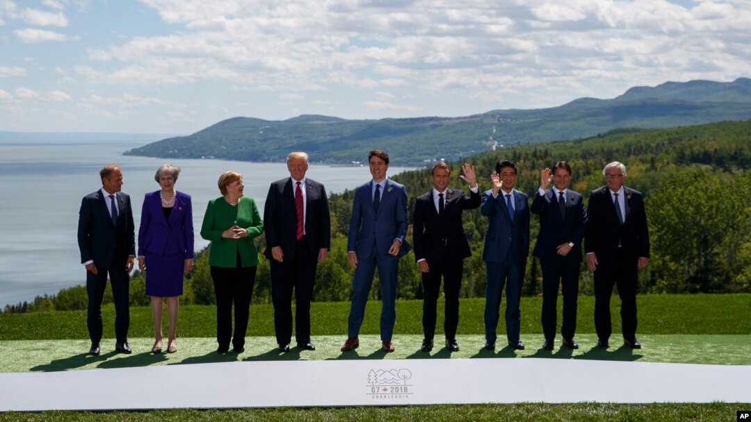 FILE - G-7 summit participants pose for a family photo, in Charlevoix, Canada, June 8, 2018, 