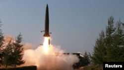 A missile is seen launched during a military drill in North Korea, in this May 10, 2019 photo supplied by the Korean Central News Agency (KCNA). 