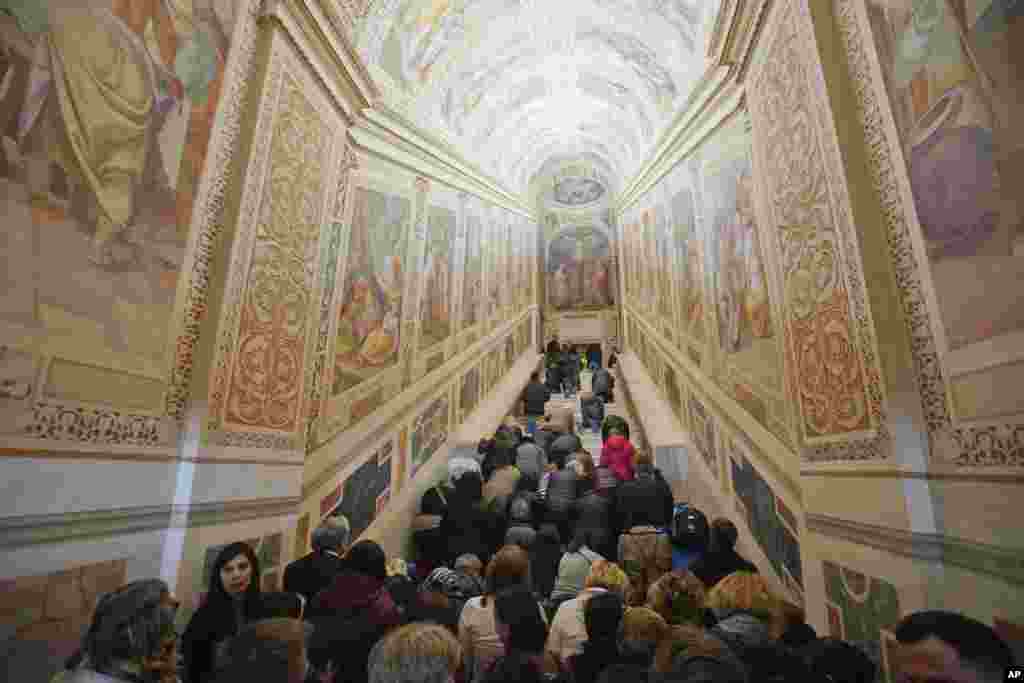 Faithful kneel on the newly restored Holy Stairs (Scala Sancta), which according to the Catholic Church is the stairway on which Jesus Christ stepped on his way to the crucifixion, during a special opening, in Rome, Italy.