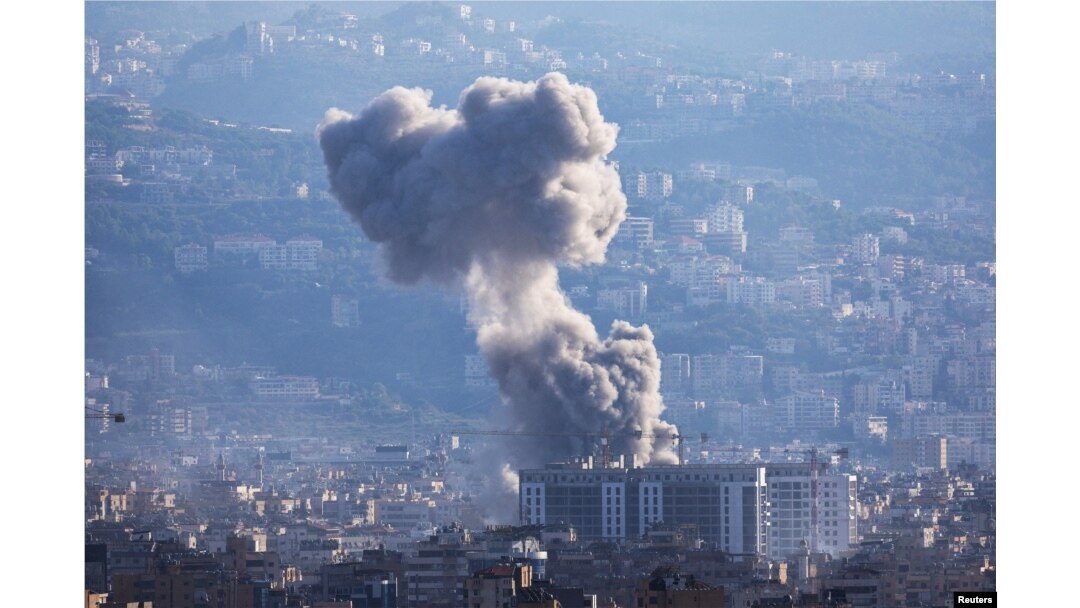 Smoke rises from Beirut southern suburbs after an Israeli strike, amid the ongoing hostilities between Hezbollah and Israeli forces, as seen from Ashrafieh, Lebanon, Nov. 21, 2024.