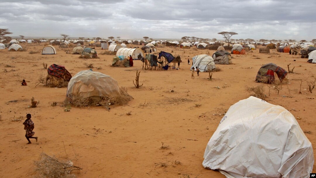 A child runs, left, at a refugee camp in Dadaab, Kenya, Aug 4, 2011.