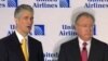 Continental CEO Jeff Smisek (left) with United CEO Glenn Tilton announcing merger of two airlines, 3 May 2010
