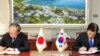 South Korea's Defense Minister Han Min-koo and Japan's Ambassador to South Korea Yasumasa Nagamine sign documents of the General Security of Military Information Agreement at the Defense Ministry in Seoul, South Korea, in this handout provided by the Defense Ministry and released by Yonhap, Nov. 23, 2016. 