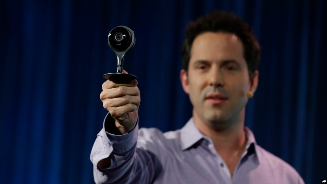 FILE - Maxime Veron, head of Hardware Product Marketing for Nest, holds up a Nest Cam during a press conference in San Francisco, June 17, 2015. 