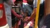 A patient breathes with the help of oxygen provided by a Gurdwara, a place of worship for Sikhs, outside a parked car along the roadside amid the coronavirus pandemic in Ghaziabad, April 26, 2021. 