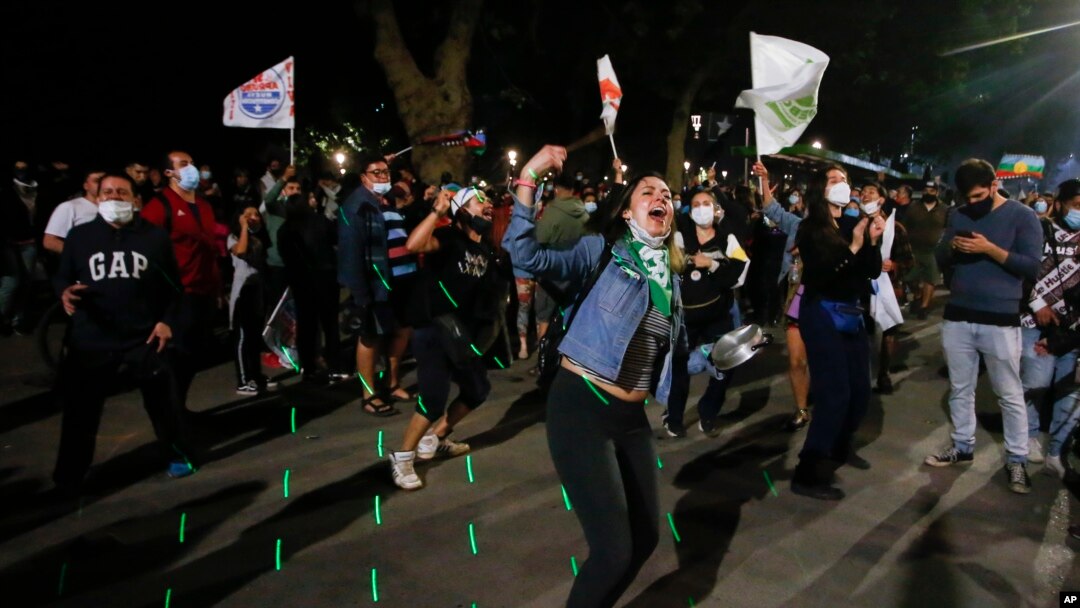 People gather at Plaza Italia on the day Chileans voted in a referendum to decide whether the country should replace its 40-year-old constitution, written during the dictatorship of Gen. Augusto Pinochet, in Santiago, Chile, Oct. 25, 2020. (AP)