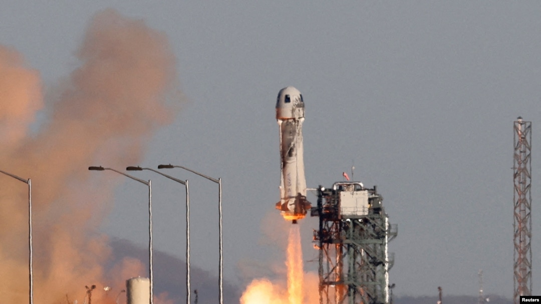 FILE - A Blue Origin New Shepard rocket lifts off from Launch Site One in west Texas, Dec. 11, 2021. 