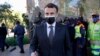 French President Emmanuel Macron gives a thumbs up after concluding his visit to the Nelson Mandela Foundation in Johannesburg on May 29, 2021.