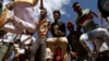 FILE - Youths dance during an Oromo Liberation Front (OLF) rally in the town of Woliso, Oromia region, Ethiopia, Oct. 21, 2018. 