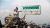 FILE - A convoy of U.S. vehicles is seen after withdrawing from northern Syria, in Erbil, Iraq, Oct. 21, 2019.