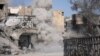 FILE - Smoke rises after a landmine is exploded as fighters of Syrian Democratic Forces clear roads after the liberation of Raqqa, Syria, Oct. 18, 2017. 