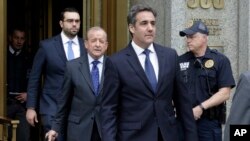 President Donald Trump's personal attorney Michael Cohen (R) and his attorney Stephen Ryan (2nd-L) leave Federal Court, in New York, May 30, 2018. 