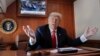 President Donald Trump, on board Air Force One, gestures while watching a live television broadcast of the Senate confirmation vote of Supreme Court nominee Brett Kavanaugh, Oct. 6, 2018. Trump was traveling from Washington to Topeka, Kan., for a campaign rally.