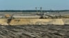 The Welzow-Sued open-pit coal mine, 70 miles south of Berlin, is one of several in eastern Germany’s Lusatia region. It is expected to expand in the coming years and consume the village of Proschim, just over a mile away.