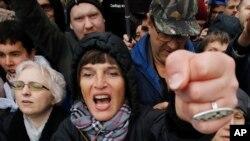 A woman shouts during a rally to support political prisoners in Moscow, Russia, Sunday, Sept. 29, 2019.