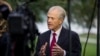 FILE - White House trade adviser Peter Navarro speaks during a television interview at the White House, Oct. 8, 2019.