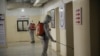 Members of a humanitarian aid agency disinfect Ibn Sina hospital as prevention against coronavirus in Idlib city, Syria, March 19, 2020. 
