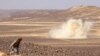 FILE - Smoke billows during clashes between forces loyal to Yemen's Saudi-backed government and Houthi rebel fighters in al-Jadaan area, northwest of Marib, central Yemen, Feb. 11, 2021.