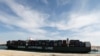 FILE - A container ship of China Shipping Line sails through the Suez Canal in Ismailia, Egypt, Nov. 17, 2019.