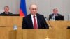 FILE - Russian President Vladimir Putin speaks during a session of the State Duma, the Lower House of the Russian Parliament, prior to its members voting on constitutional amendments, in Moscow, Russia, March 10, 2020.