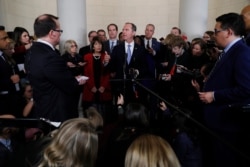 FILE - House Intelligence Committee Chairman Adam Schiff, D-Calif., talks to the media after a hearing with testimony from top U.S. diplomats in Ukraine.