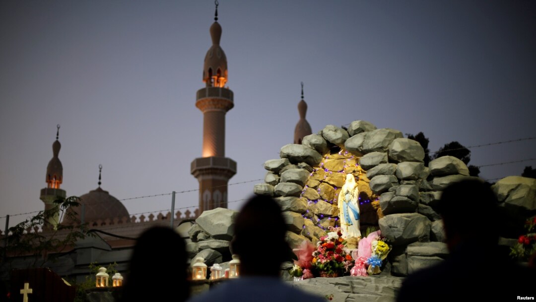 Expat worshippers pray in front of St. Mary's shrine at St. Mary's Catholic Church in Oud Metha, as Catholics await a historic visit by Pope Francis to the United Arab Emirates, in Dubai, UAE, Jan. 18, 2019.