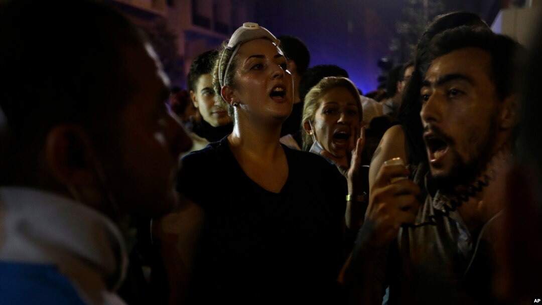 Lebanese anti-government demonstrators shout slogans during a protest against the ongoing trash crisis and government corruption in Beirut, Sept. 9, 2015.