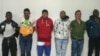 A handout picture released on August 10, 2023, by the Ecuadorian Police shows six Colombian men arrested in connection with the assassination of presidential candidate Fernando Villavicencio in Quito.