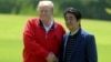 Japan's Prime Minister Shinzo Abe welcomes U.S. President Donald Trump upon his arrival at Mobara Country Club in Mobara, Chiba prefecture, Japan, May 26, 2019.