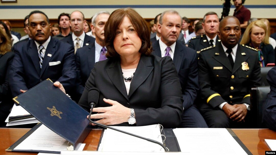 FILE - U.S. Secret Service Director Julia Pierson takes her seat to testify at the House Oversight and Government Reform Committee hearing on "White House Perimeter Breach: New Concerns about the Secret Service" on Capitol Hill, Sept. 30, 2014. 