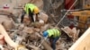 FILE - Volunteers dig through the rubble of buildings which collapsed due to the explosion at the port area, after signs of life were detected, in Gemmayze, Beirut, Lebanon, Sept. 5, 2020.