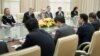 U.S. Secretary of State Hillary Rodham Clinton, left, listens to Chinese Foreign Minister Yang Jiechi, right, during their meeting at the Peace Palace in Phnom Penh, Cambodia, July 12, 2012.