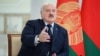 (FILES) Belarus' President Alexander Lukashenko speaks as he meets with foreign media at his residence, the Independence Palace, in the capital Minsk on February 16, 2023.