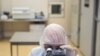 FILE PHOTO: A specialist works at Binnopharm pharmaceutical plant which develops "Gam-COVID-Vac" vaccine against the coronavirus disease near Moscow