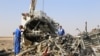 Russian emergency services personnel working at the crash site of a A321 Russian airliner in Wadi al-Zolomat, a mountainous area of Egypt's Sinai Peninsula. (Russian Emergency Ministry Handout photo)