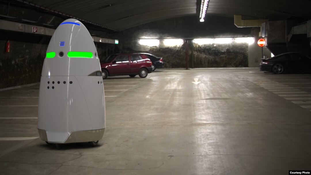 This photo from California manufacturer Knightscope shows the company's K5 security robot keeping tabs on a parking area.