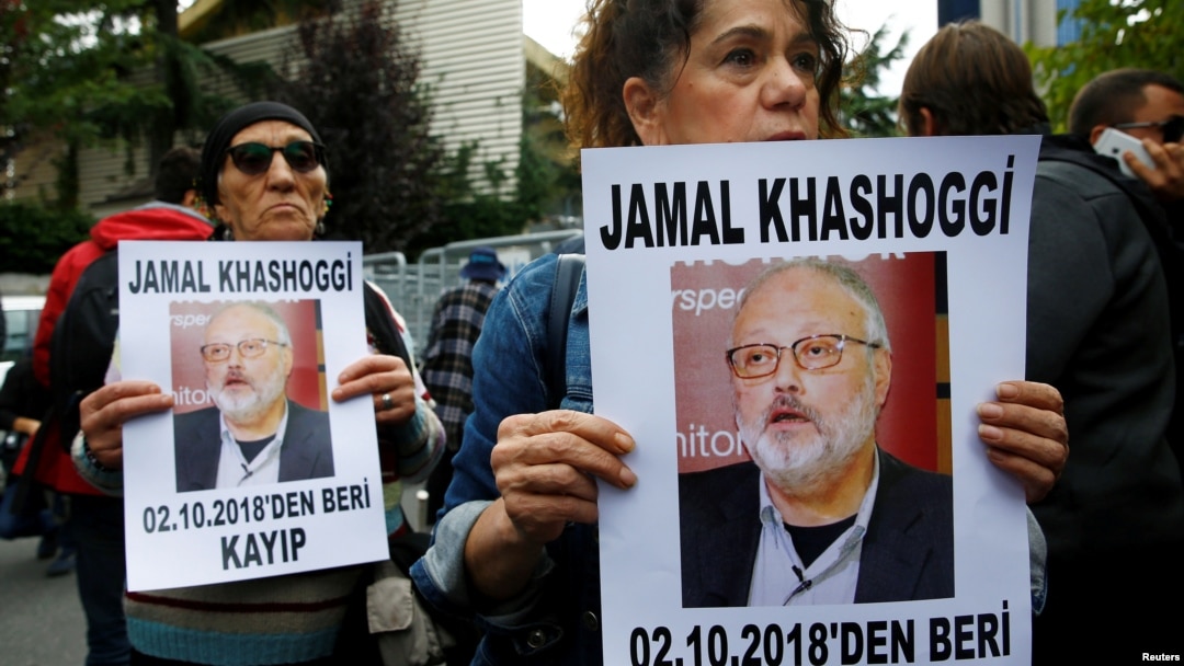 Human rights activists hold pictures of Saudi journalist Jamal Khashoggi during a protest outside the Saudi Consulate in Istanbul, Turkey, Oct. 9, 2018.