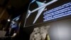 Visuals are displayed during a news conference by Russian arms maker Almaz-Antey at which it presented the results of its probe of last year's downing of Malaysia Airlines flight MH17 over eastern Ukraine, in Moscow, Russia, Oct. 13, 2015. 