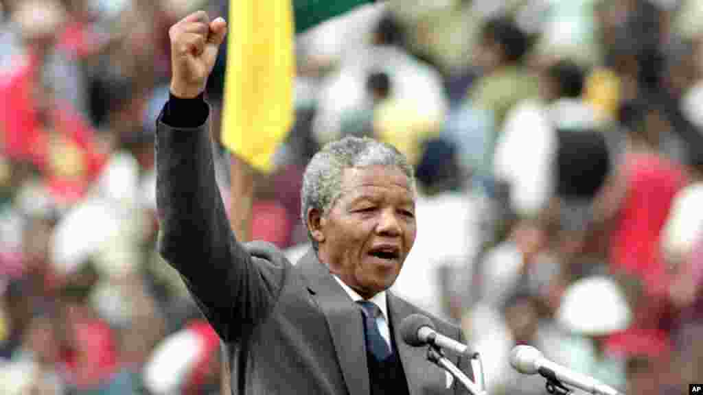 ANC leader and symbol of resistance to apartheid, Nelson Mandela, is seen as he gives the black power salute to the 120,000 ANC supporters in Soweto's Soccer City stadium in Soweto, near Johannesburg, South Africa, Feb. 13, 1990.